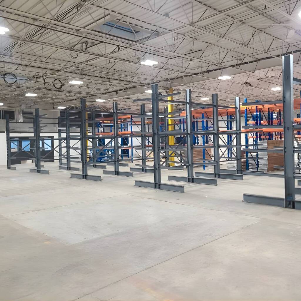Heavy-duty industrial cantilever racking installation showing multiple storage arms for oversized inventory.
