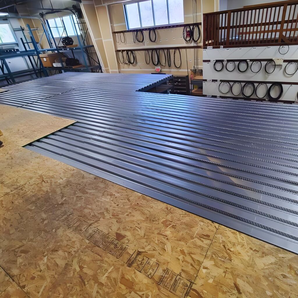 Completed industrial work platform installation with safety yellow handrails and high-density floor decking.